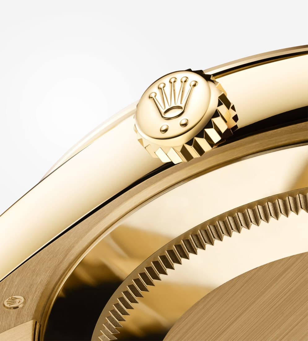 Rolex day-date, highlighting fluted bezel and Rolex crown 