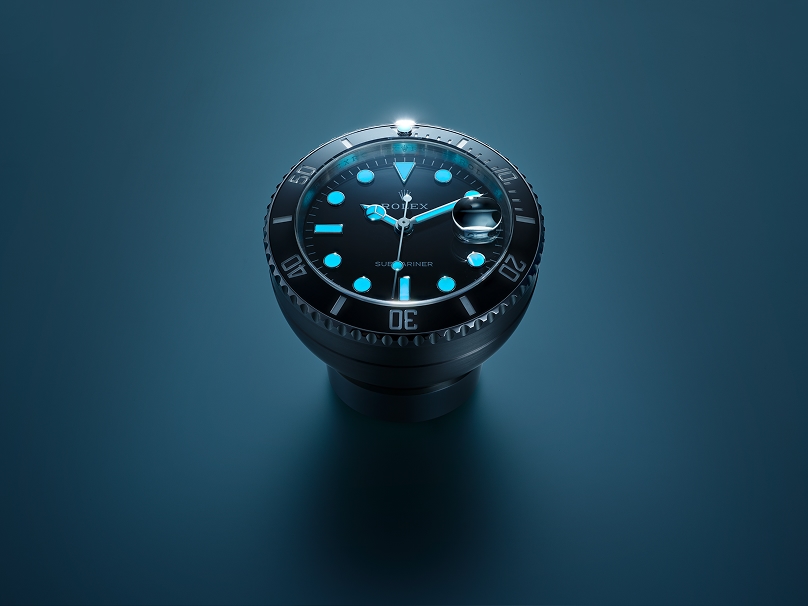 Rolex calendar clock glowing Chromalight display